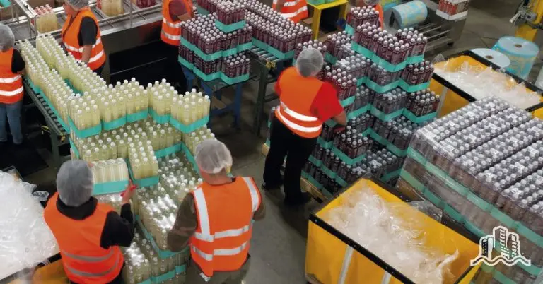 Workers in beverage packaging facility